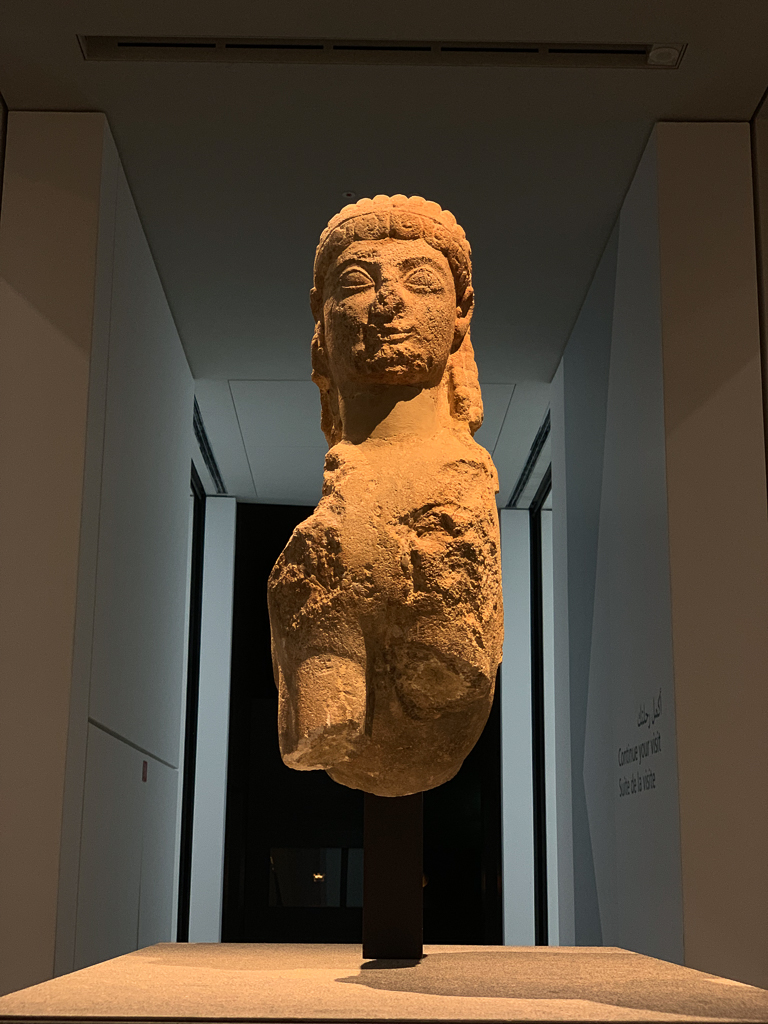 Sphinx, mythological creature, Greece or Italy, 600–500 BCE, H. 57 cm; limestone, Louvre Abu Dhabi, LAD 2013.004
